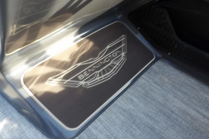 Slide: The Image of 2026 Bennington M L-Bench 22 ML logo on sleek boat flooring. - 29