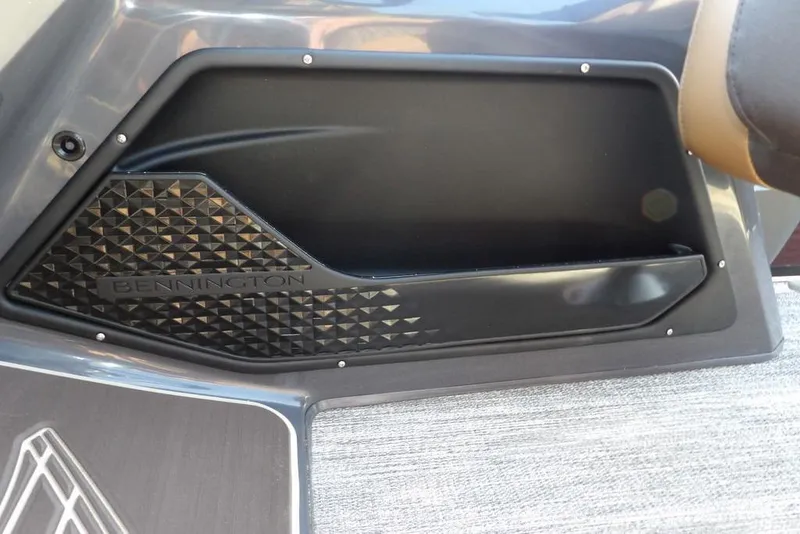 Slide: The Image of 2026 Bennington M L-Bench 22 ML interior detail with textured panel and storage compartment. - 30