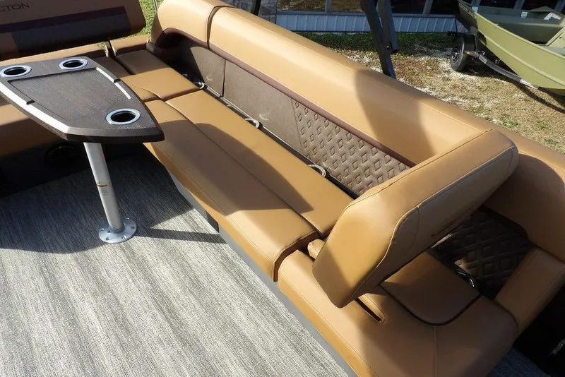 Slide: The Image of 2026 Bennington M L-Bench 22 ML boat interior with tan seating and table. - 32