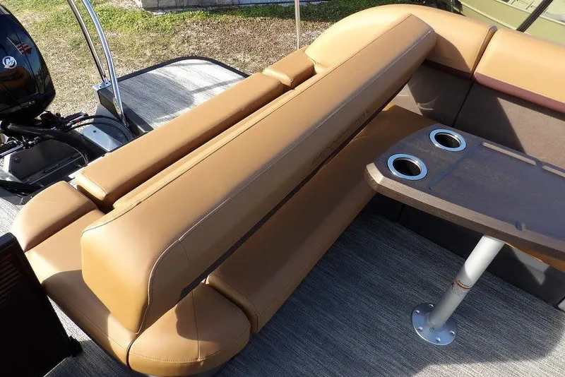 Slide: The Image of 2026 Bennington M L-Bench 22 ML boat interior with tan seating and cupholders. - 34