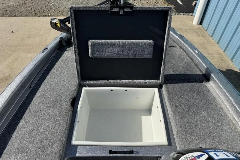 Slide: The Image of 2012 Skeeter TZX190 boat storage compartment open, revealing spacious interior. - 11