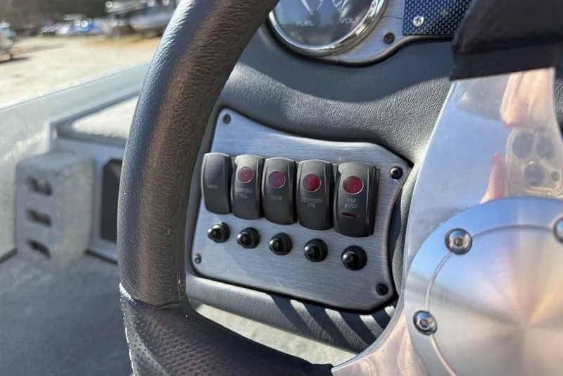 Slide: The Image of 2012 Skeeter TZX190 dashboard with switches and steering wheel detail. - 18