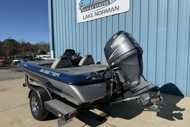 Slide: The Image of 2012 Skeeter TZX190 boat with Yamaha engine at Lake Norman marine center. - 2
