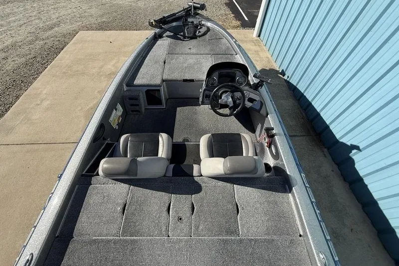 Slide: The Image of 2012 Skeeter TZX190 boat interior with dual seats and steering console. - 26