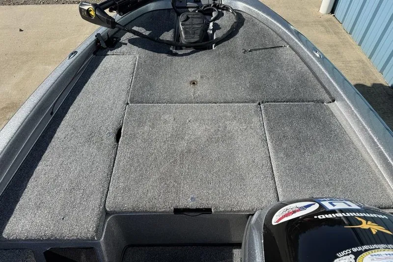 Slide: The Image of 2012 Skeeter TZX190 boat deck with carpeted surface and trolling motor. - 6