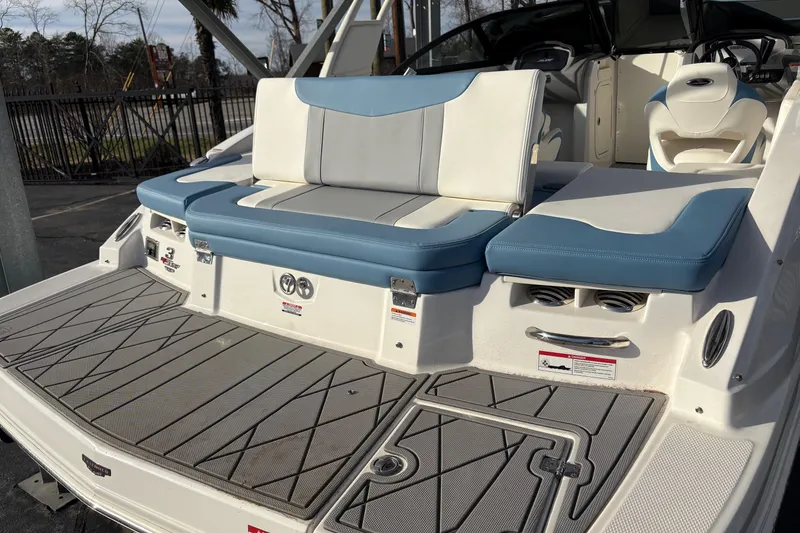 Slide: The Image of 2026 Chaparral GTS 3 boat with blue and white seating, spacious deck, and modern design. - 12