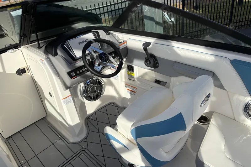 Slide: The Image of 2026 Chaparral GTS 3 boat interior with steering wheel and control panel. - 4