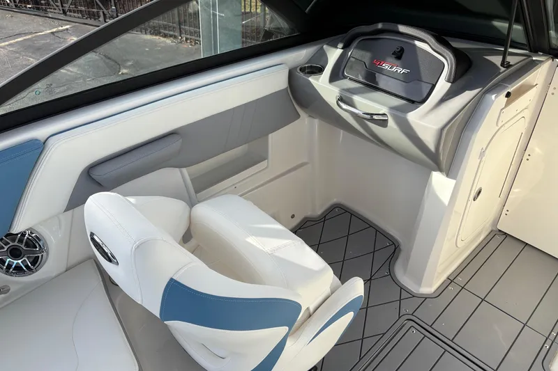 Slide: The Image of 2026 Chaparral GTS 3 boat interior with white and blue seating, modern dashboard. - 7