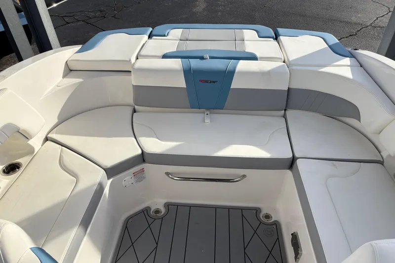 Slide: The Image of 2026 Chaparral GTS 3 boat interior with white and blue seating arrangement. - 8