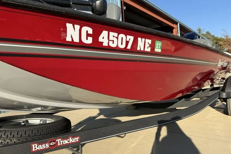 Slide: The Image of 2021 Tracker Bass Tracker Classic XL boat on trailer, red with registration number NC 4507 NE. - 10