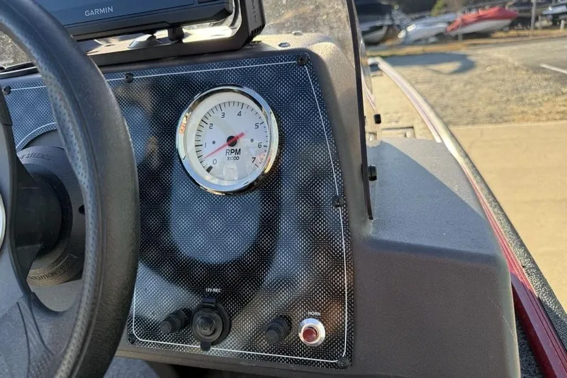 Slide: The Image of 2021 Tracker Bass Tracker Classic XL dashboard with RPM gauge and Garmin device. - 16