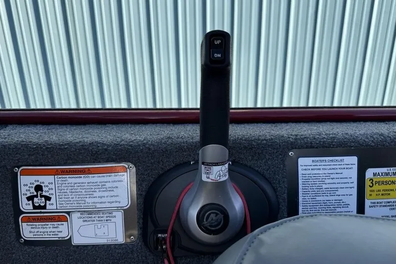 Slide: The Image of 2021 Tracker Bass Tracker Classic XL boat controls with warning labels and checklist. - 19