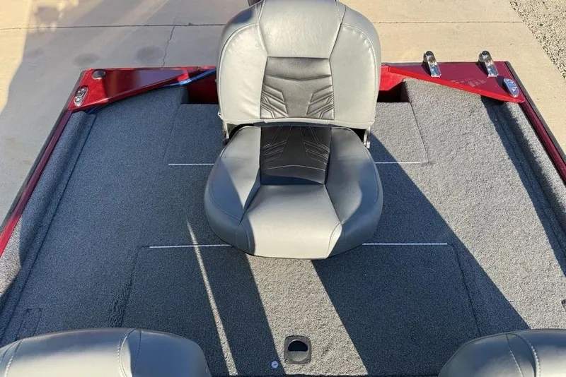 Slide: The Image of 2021 Tracker Bass Tracker Classic XL boat interior with gray seating and carpeted deck. - 26
