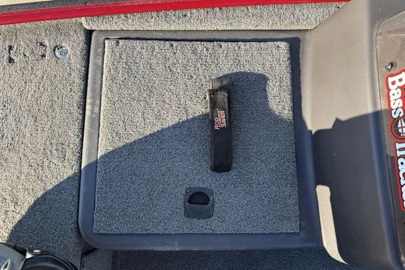 Slide: The Image of 2021 Tracker Bass Tracker Classic XL boat deck with storage compartment and rod strap. - 4