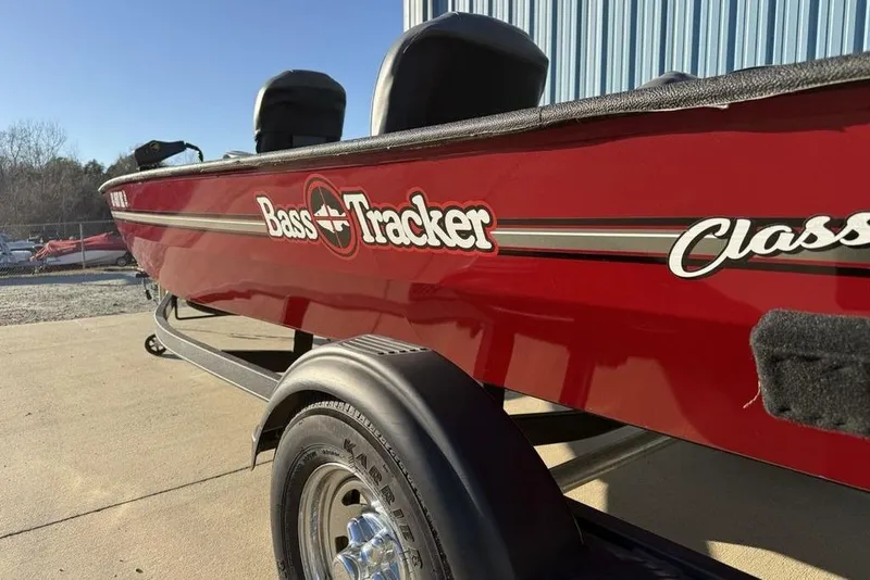 Slide: The Image of 2021 Tracker Bass Tracker Classic XL boat in vibrant red on a trailer. - 8