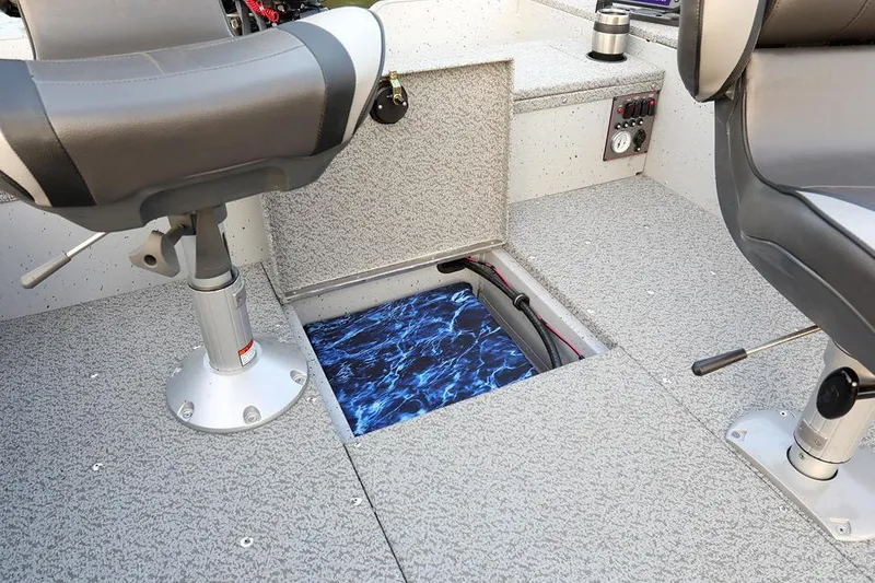 Slide: The Image of Manufacturer Provided Image: 2024 Lund 1675 Alaskan Tiller boat interior with open storage compartment. - 20