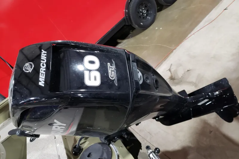 Slide: The Image of 2024 Lund 1675 Alaskan Tiller with Mercury 60 HP outboard motor in a showroom. - 5