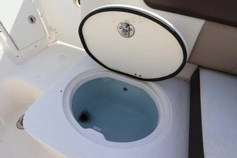 Slide: The Image of 2019 Robalo R242 Center Console boat's open storage compartment. - 11