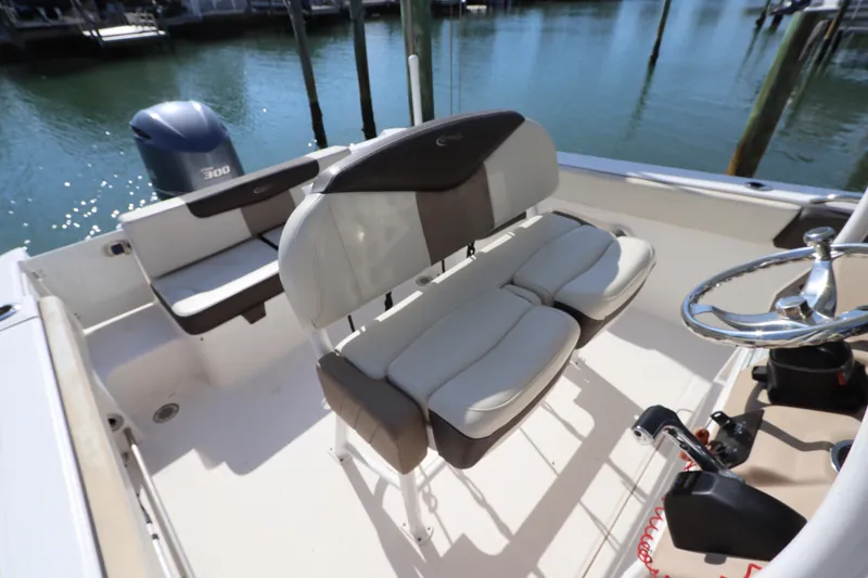 Slide: The Image of 2019 Robalo R242 Center Console boat interior with seating and steering wheel. - 13