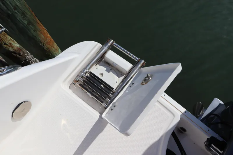 Slide: The Image of 2019 Robalo R242 Center Console boat ladder and deck detail. - 5