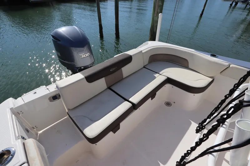Slide: The Image of 2019 Robalo R242 Center Console boat with Yamaha 300 engine and cushioned seating. - 10