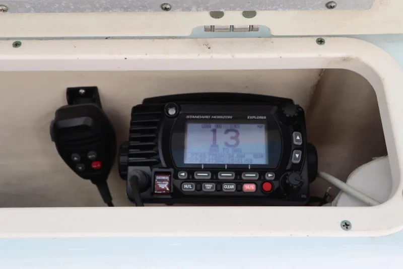 Slide: The Image of VHF radio system in 2019 Robalo R242 Center Console boat compartment. - 21