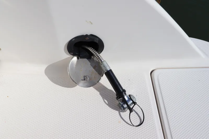 Slide: The Image of Fuel cap and hose on 2019 Robalo R242 Center Console boat deck. - 6