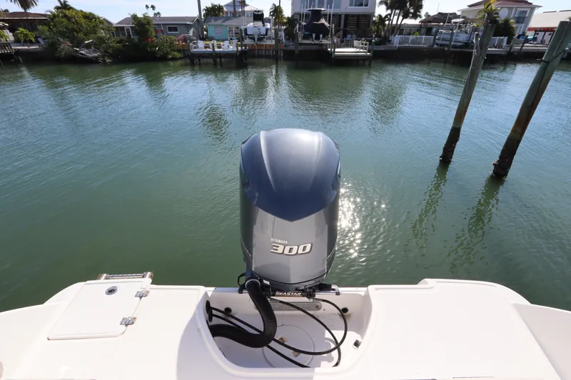 Slide: The Image of 2019 Robalo R242 Center Console with Yamaha 300 engine on calm water. - 4