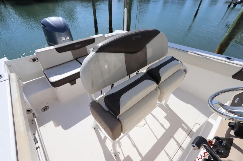 Slide: The Image of 2019 Robalo R242 Center Console boat interior with seating and steering wheel. - 14
