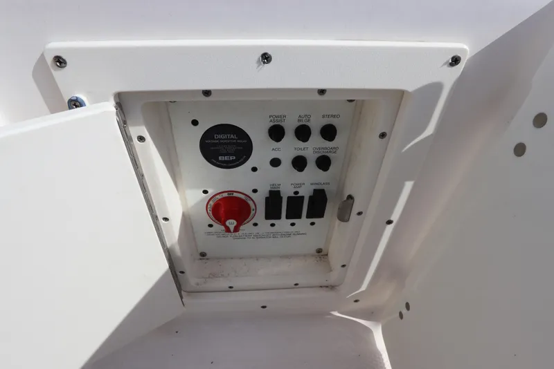Slide: The Image of Control panel of a 2019 Robalo R242 Center Console boat, featuring various switches. - 9