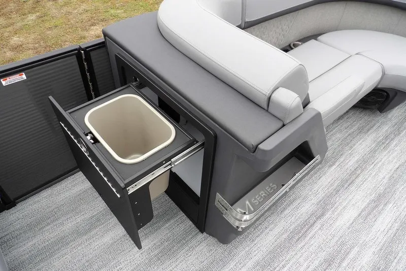 Slide: The Image of 2026 Bennington M L-Bench 22 ML boat interior with pull-out trash bin and seating. - 14