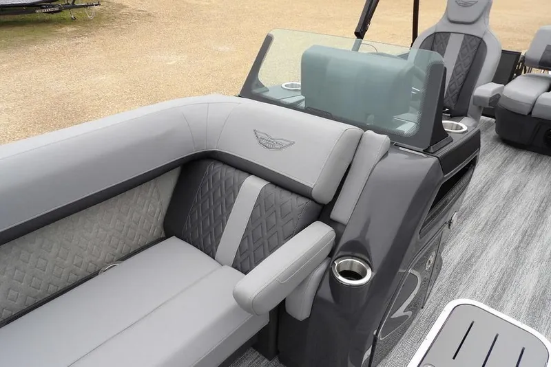 Slide: The Image of 2026 Bennington M L-Bench 22 ML pontoon boat interior with gray seating and cup holders. - 15