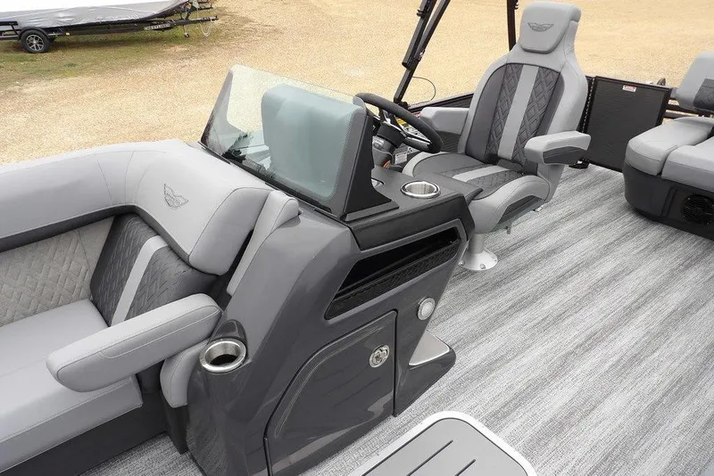 Slide: The Image of 2026 Bennington M L-Bench 22 ML boat interior with gray seating and modern helm. - 16
