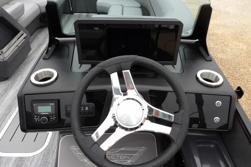 Slide: The Image of 2026 Bennington M L-Bench 22 ML boat dashboard with steering wheel and controls. - 17