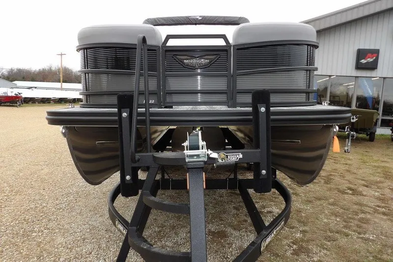 Slide: The Image of 2026 Bennington M L-Bench 22 ML pontoon boat on trailer, front view. - 3