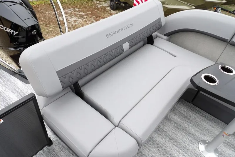 Slide: The Image of 2026 Bennington M L-Bench 22 ML boat interior with gray seating and cup holders. - 39