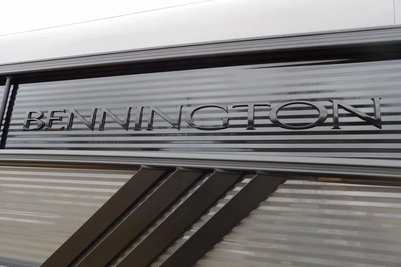 Slide: The Image of Bennington M L-Bench 22 ML 2026 model logo on sleek metallic surface. - 49