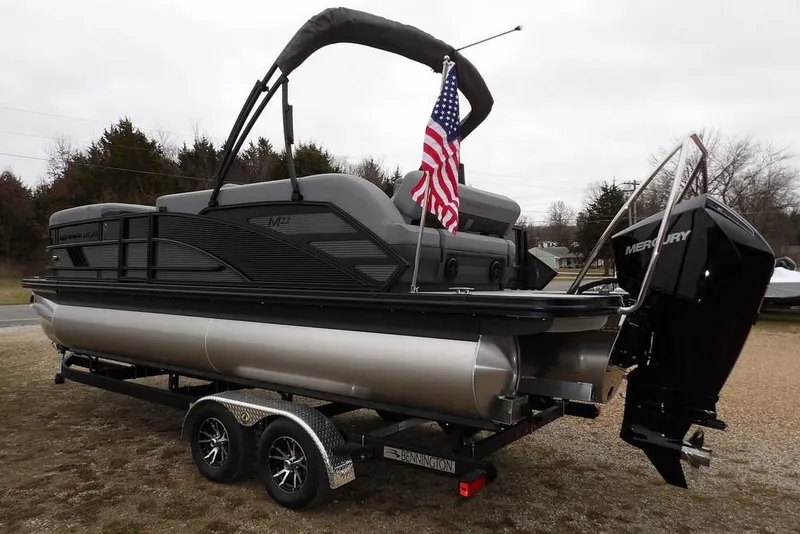 Slide: The Image of 2026 Bennington M L-Bench 22 ML pontoon boat with Mercury engine and American flag. - 5