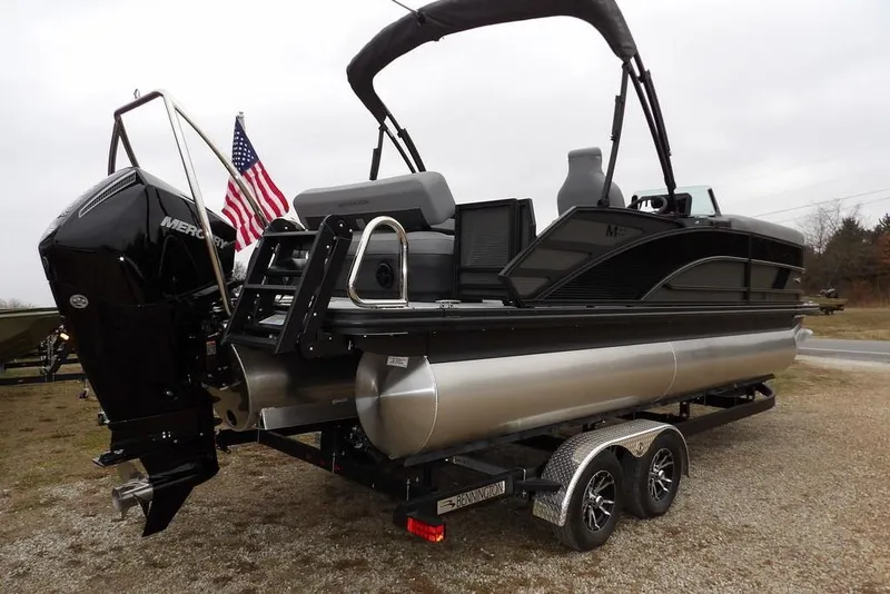 Slide: The Image of 2026 Bennington M L-Bench 22 ML pontoon boat on trailer, featuring Mercury engine. - 9