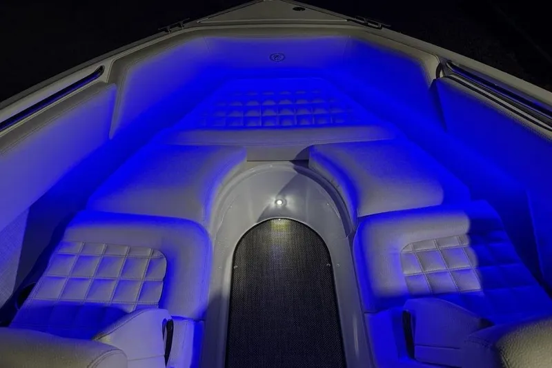 Slide: The Image of 2017 Cobalt R3 boat interior with blue LED lighting and cushioned seating. - 1