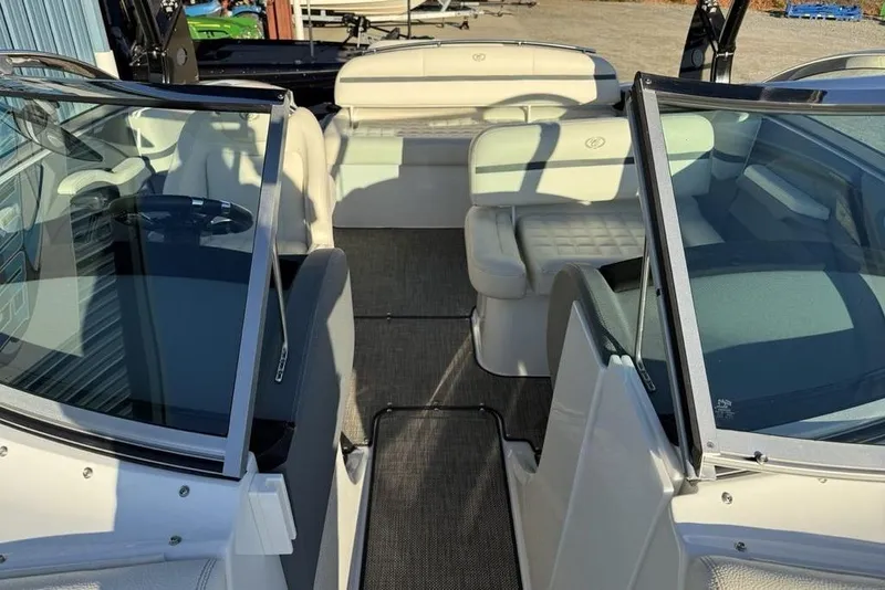Slide: The Image of 2017 Cobalt R3 boat interior with white seating and glass windshields. - 16