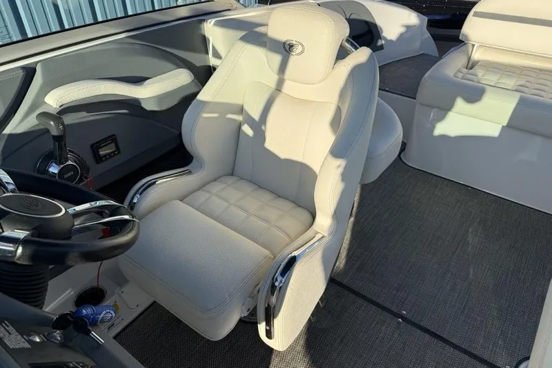 Slide: The Image of Interior of a 2017 Cobalt R3 boat featuring a luxurious white captain's chair. - 18