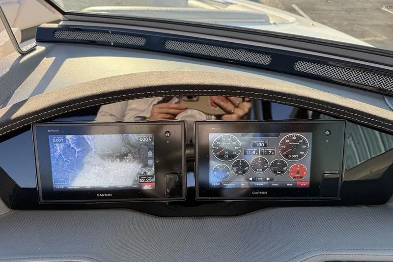 Slide: The Image of Dashboard of a 2017 Cobalt R3 boat with Garmin navigation displays. - 20