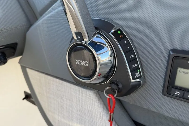 Slide: The Image of Volvo Penta throttle control on 2017 Cobalt R3 boat dashboard. - 24