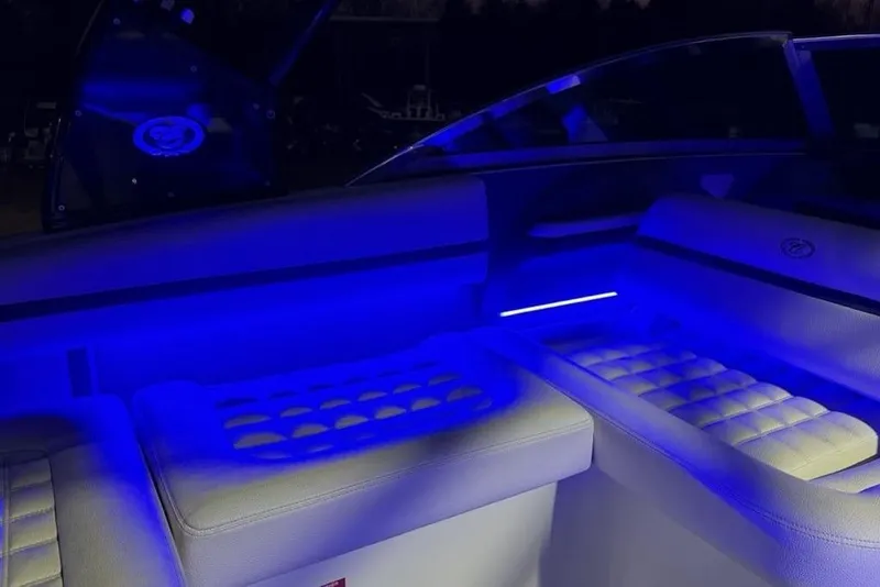 Slide: The Image of 2017 Cobalt R3 boat interior with blue LED lighting and cushioned seating. - 32
