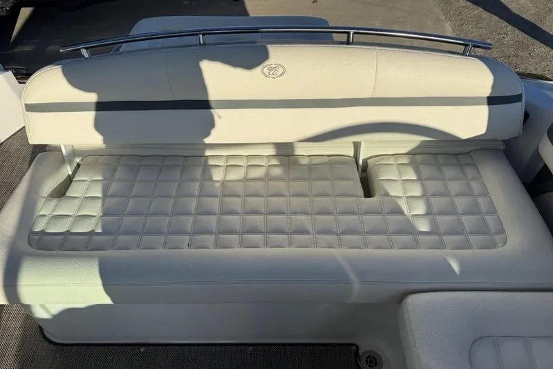Slide: The Image of 2017 Cobalt R3 boat seat with quilted white upholstery and metal railing. - 38