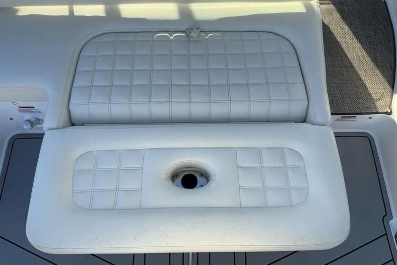 Slide: The Image of 2017 Cobalt R3 boat seat with white quilted upholstery and cup holder. - 46