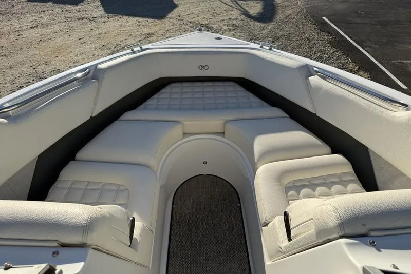 Slide: The Image of 2017 Cobalt R3 boat interior with white cushioned seating and sleek design. - 7