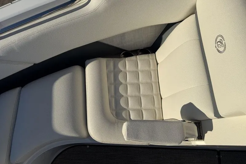 Slide: The Image of Luxurious white seating in a 2017 Cobalt R3 boat, featuring elegant stitching and logo. - 8