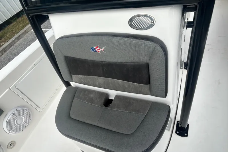 Slide: The Image of 2022 Crevalle 26 HBW boat seat with American flag fish logo, gray upholstery. - 18